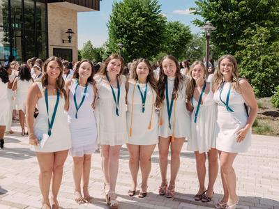 A group of nursing graduates posing together.