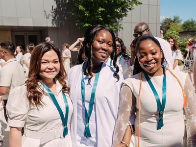 A group of nursing graduates posing together.