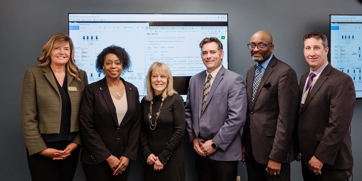 AACPS and AACC leaders pose together in the cyber range.