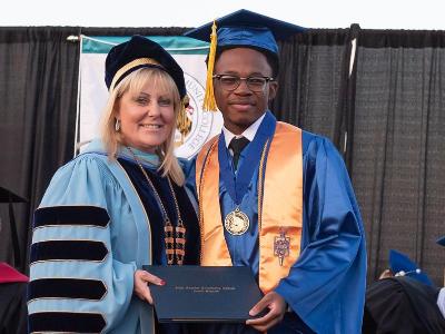 Commencement photo with president.
