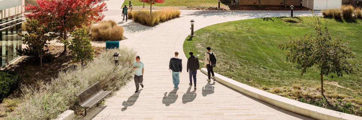 Students walking across campus in fall