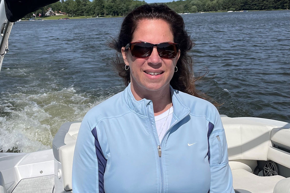 Mary Bachkosky driving a boat