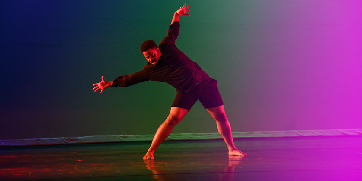 AACC dancer performs on stage.