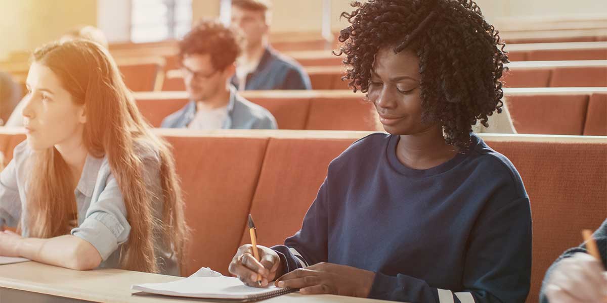 Students in a classroom taking notes.