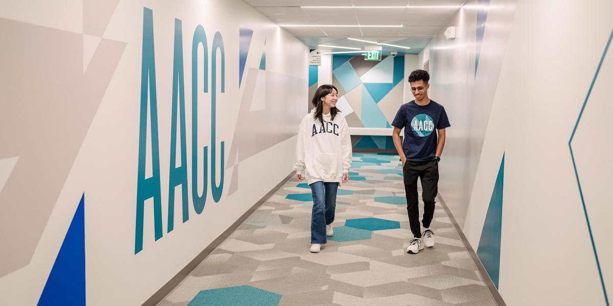 Students walking down hallway.