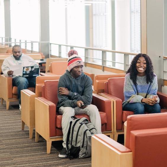 Students sitting and talking in Library.
