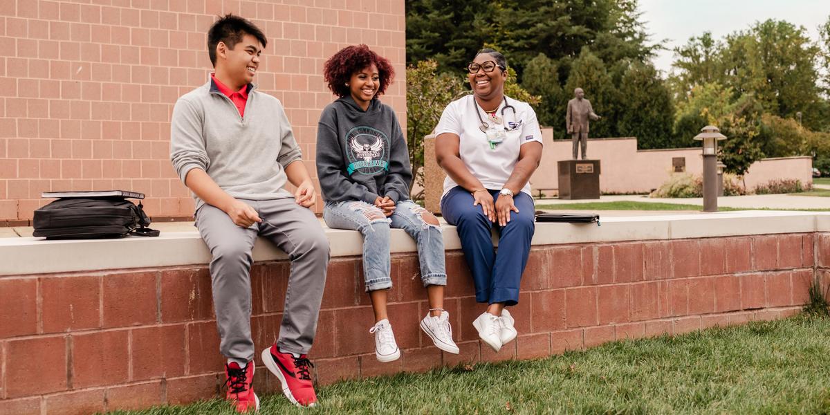 AACC students talking outside.