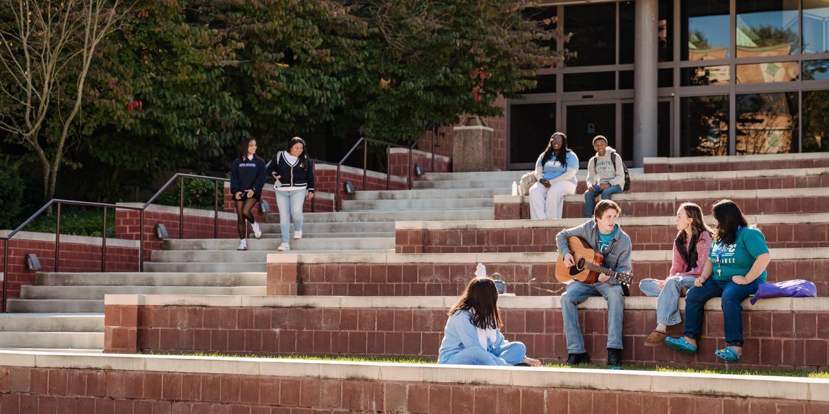 Students hanging out around CADE amphitheater.